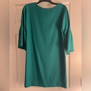Green dress with tie in back and fluttery sleeves